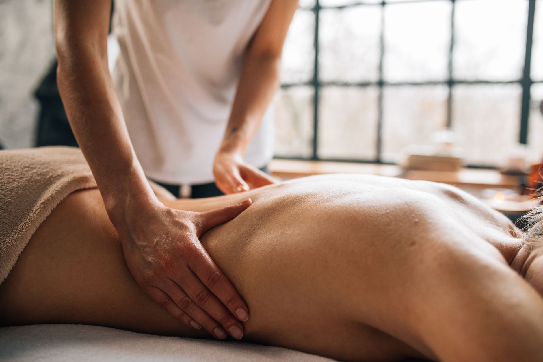 Photo by KoolShooters on Pexels Experience relaxation with a full body massage in a serene indoor spa environment.