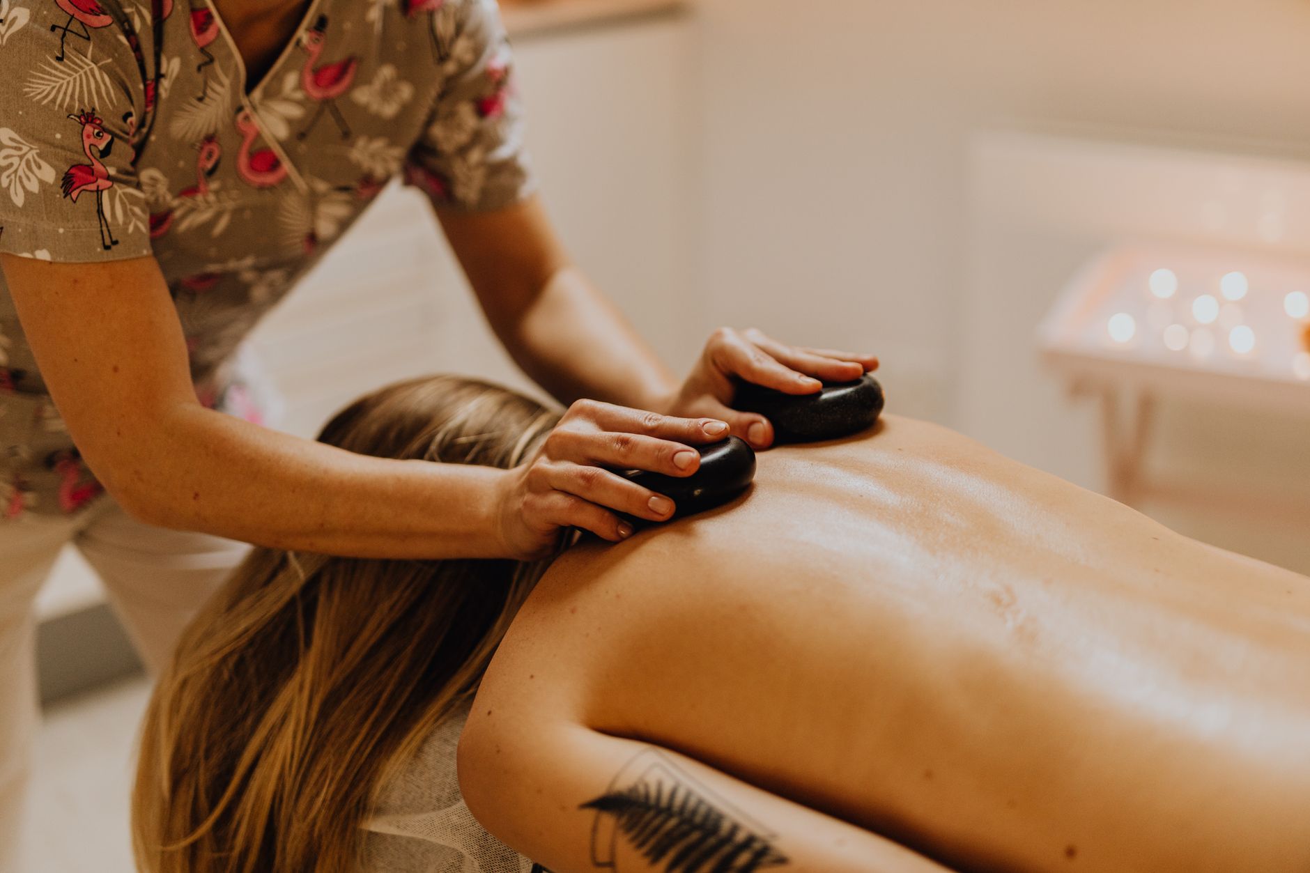 A serene hot stone massage session promoting relaxation and wellness in a spa setting.