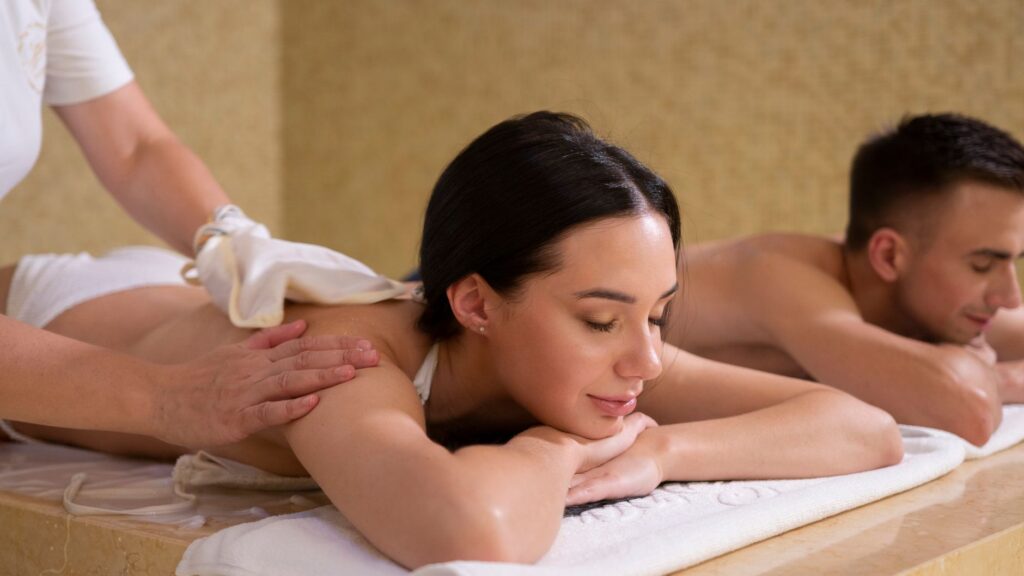 A serene spa experience with a couple enjoying a relaxing massage.