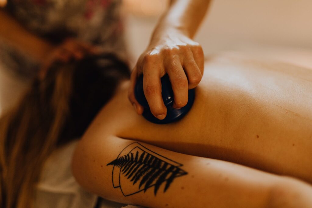 A soothing massage therapy session using cupping technique for relaxation and relief.