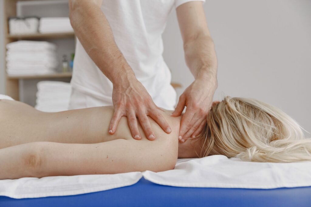 A tranquil massage session focusing on relaxation and self-care, featuring a woman receiving a back massage.